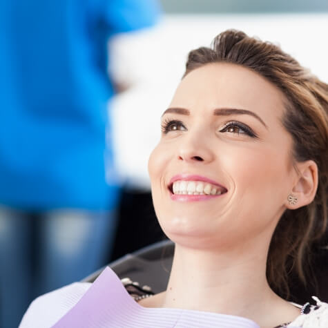 Woman with flawless smile after visiting the dentist