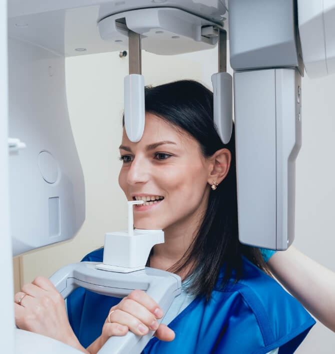 Woman receiving 3 D C T cone beam x-ray scan