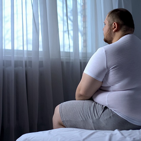 Man sitting in bed