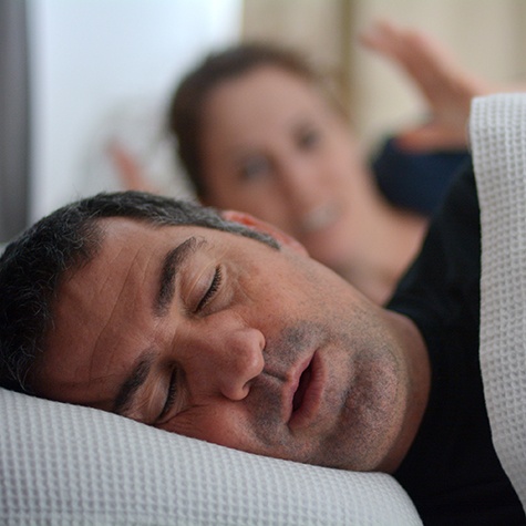 Man sleeping on his back
