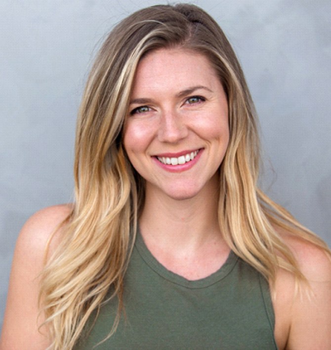 a woman smiling with a dental bridge in McKinney