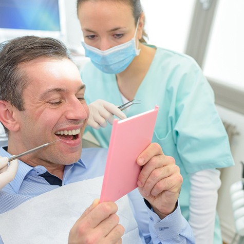 man completing procedure for dental crowns in McKinney