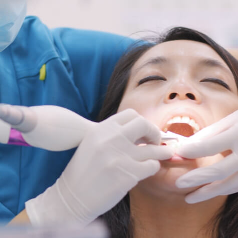 Patient receiving scaling and root planing treatment