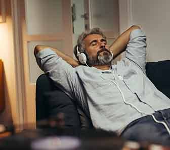Patient in McKinney relaxing with dental implants