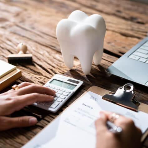 Dental patient calculating dental insurance coverage