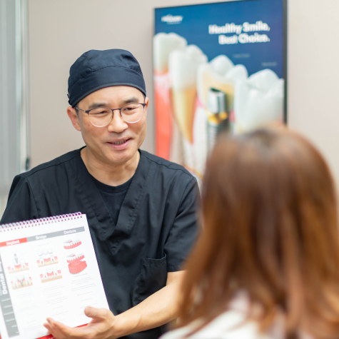 Doctor Cha discussing dental treatment plan with patient