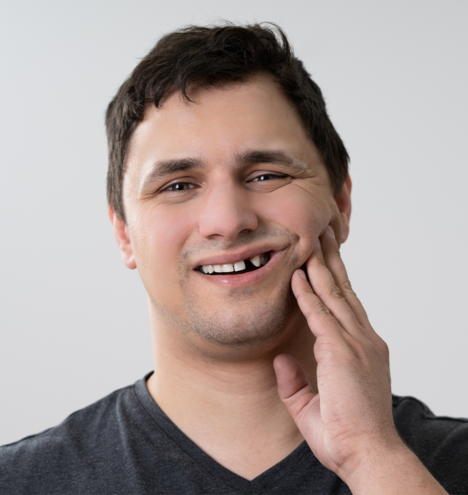 Man with missing top tooth