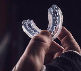 Athlete holding mouthguard