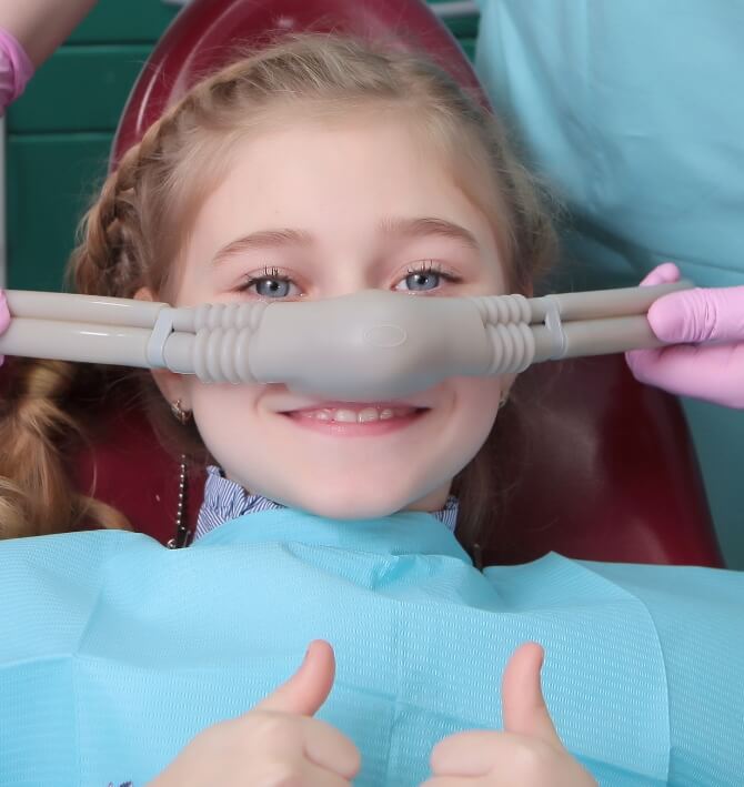 Child receiving nitrous oxide sedation dentistry