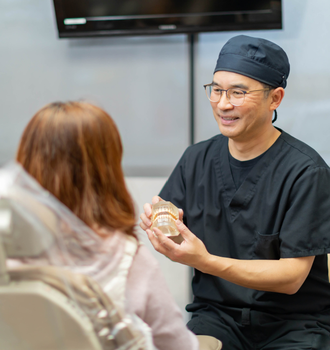 Dentist discussing dental services with dentistry patient