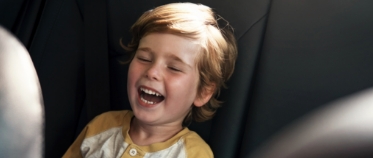 Child laughing during children's dentistry visit