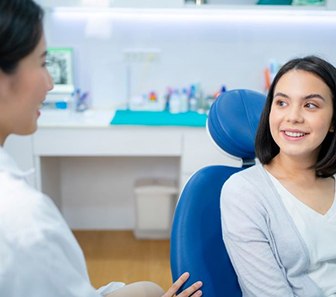 Patient and dental team member engaged in conversation