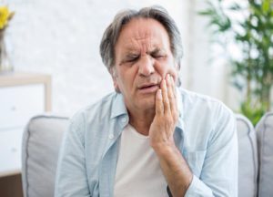 mature man with toothache