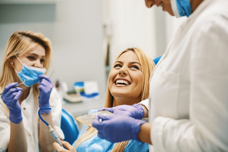 patient smiling after getting metal-free crown in McKinney